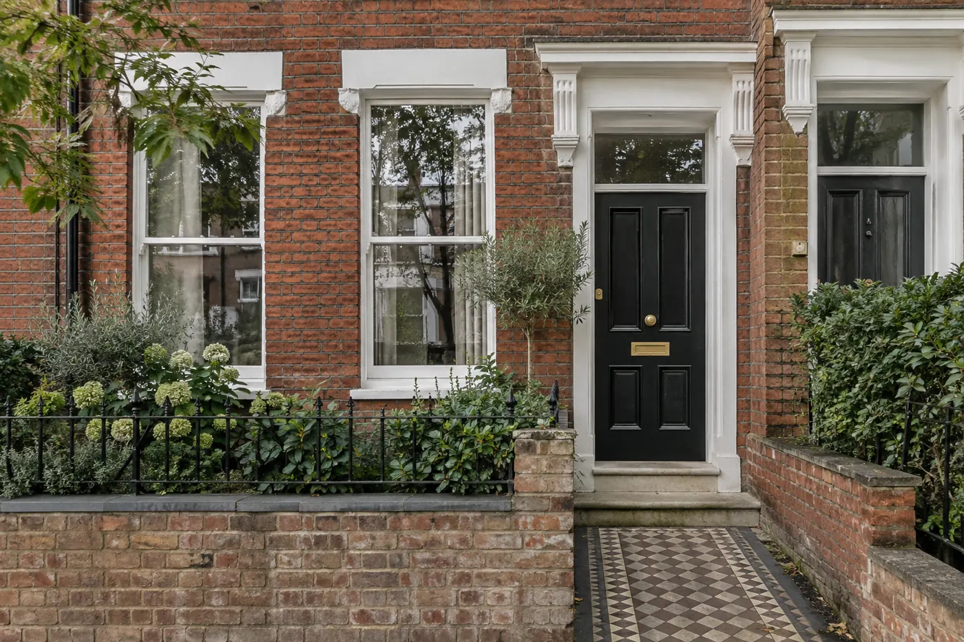 Entrance to a London rental property with a red brick facade